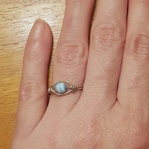 Silver wire wrap ring with blue & white bead